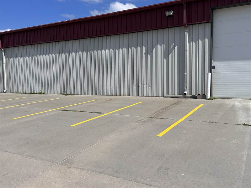 Sharp, fully repainted parking lines on the same business lot after re-striping