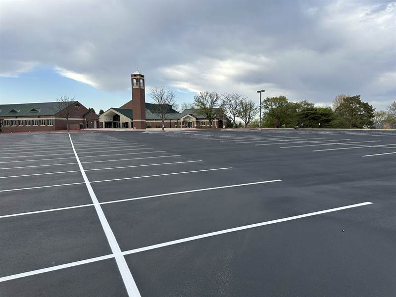 New parking layout striped on the freshly sealcoated lot