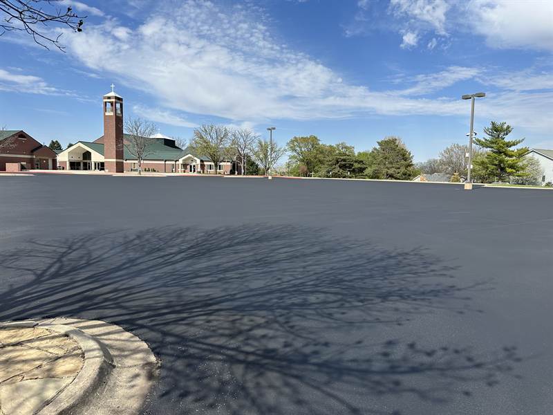 Freshly sealcoated large church parking lot before new line striping