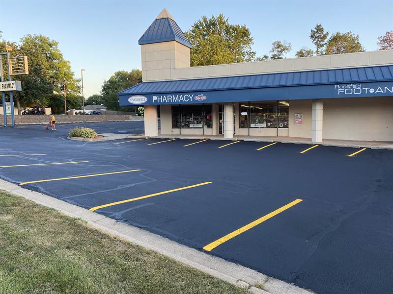 Sharp yellow parking lines with crisp contrast on freshly striped blacktop