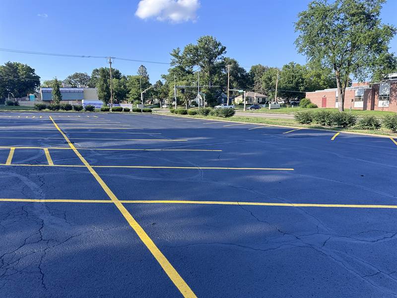 Freshly painted asphalt parking lot with crisp, high-contrast lines