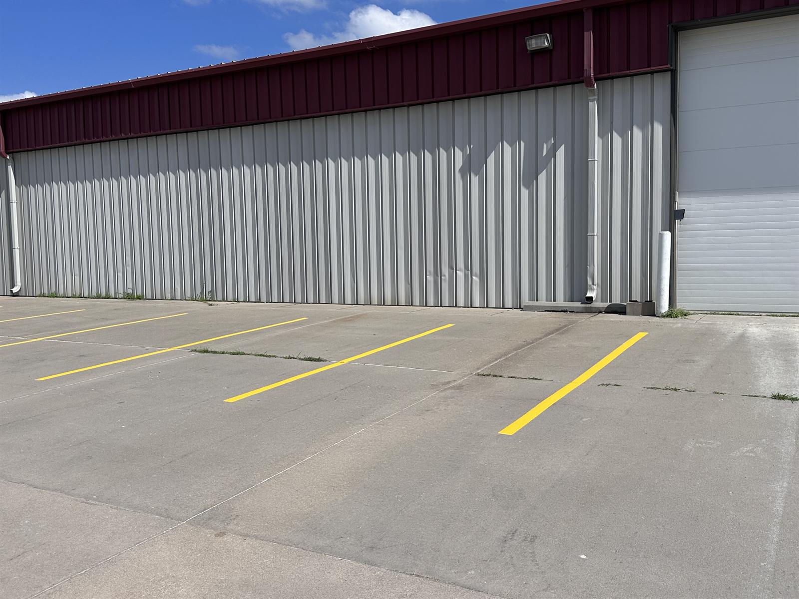 Sharp, fully repainted parking lines on the same business lot after re-striping