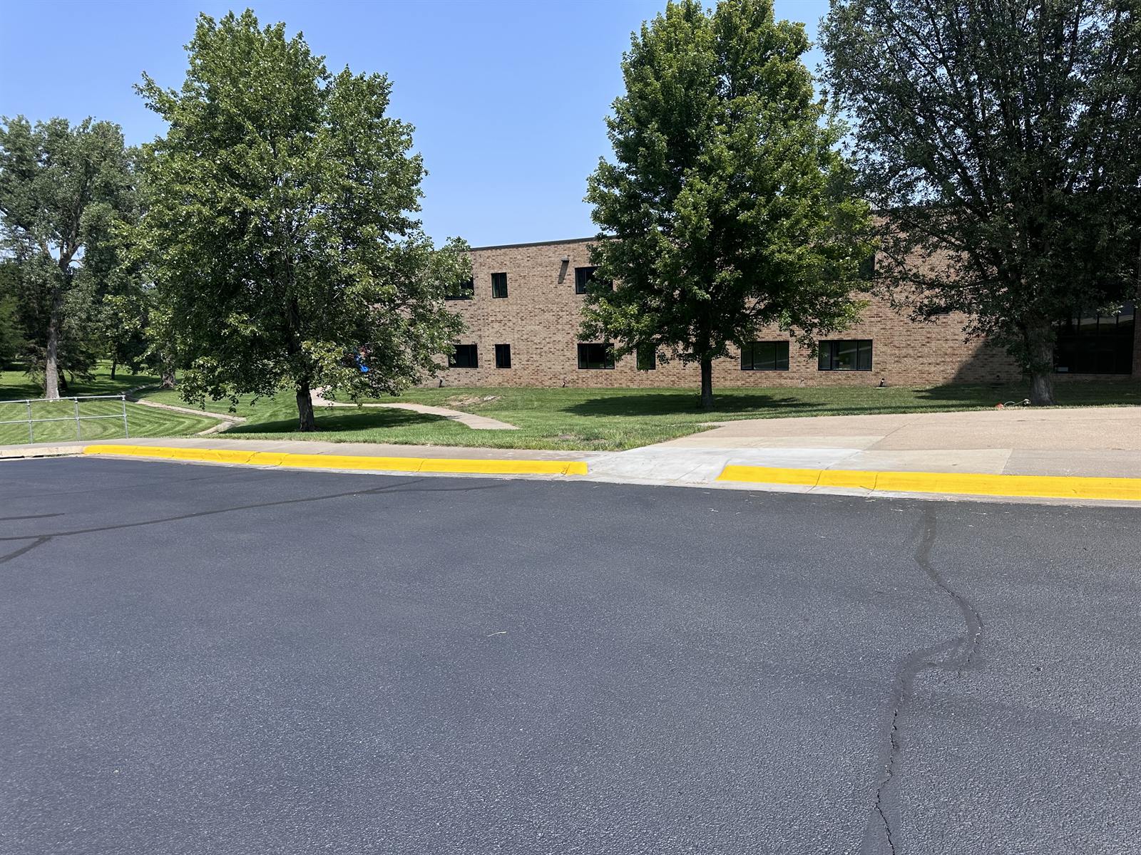 Bright, fresh yellow curb paint after repainting