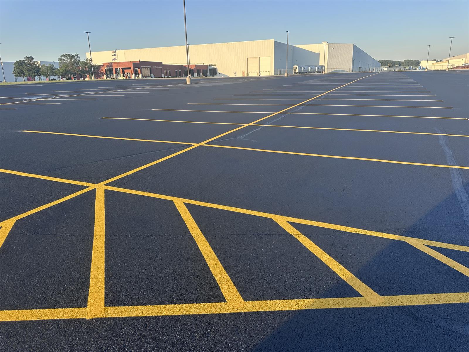 Freshly painted parking lot stalls on a large Las Cruces property